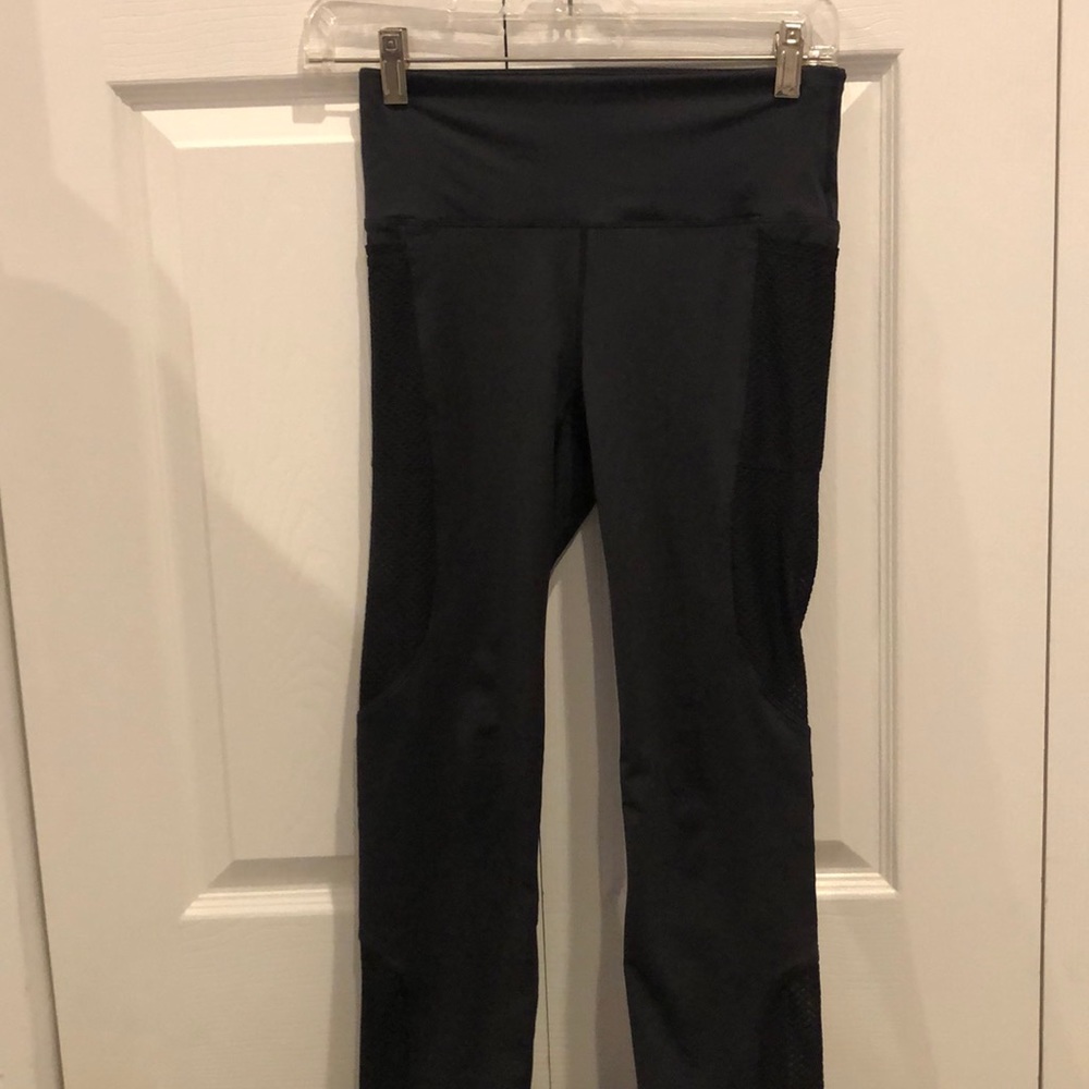 Black leggings with mesh and rips on side
